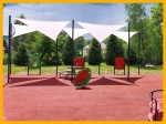Three premium white triangular sun sail shades mounted on black masts over a playground.