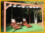Horizontal custom-made PVC Roman blind mounted on a wooden pergola with garden sun loungers.