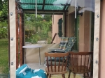 Custom-made transparent terrace cover made of PVC foil protecting the gazebo from rain and wind.