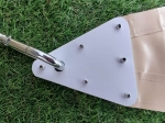 Reinforced corner of the triangular white mounting plate for a custom-made waterproof shade sail.