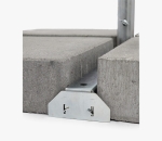 Concrete base for event umbrella with metal stabilisation rail and steel mast.