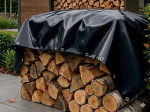 Custom-made firewood tarpaulin, protecting the log pile from rain and moisture.