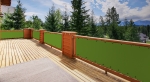Waterproof green bespoke balcony screen mounted on a wooden terrace railing overlooking the forest.