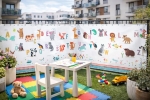 Children's balcony mat with colourful alphabet and animals, custom-size screen with mounting eyelets.
