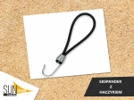 Black rubber expander with a plastic hook for securing sun sails against a sand background.