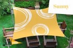 Yellow square 3x3 m garden sun sail with white patterns, suspended over wooden chairs on the lawn.