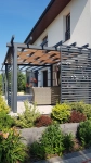 Waterproof gazebo strip 0,4x5m interwoven on a modern terrace pergola next to a house with a garden.