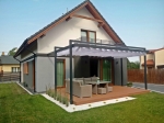 Horizontal premium Roman blind Decor 3x5 mounted on a grey terrace pergola at a modern detached house.