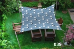 Waterproof 3x4 m sun sail with balloons, mounted over wooden furniture on a green lawn.