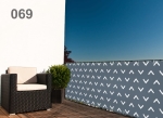 Made-to-measure grid balcony screen in grey and white patterns, installed on a balcony with a black armchair and plant.
