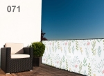 Custom-made white balcony screen with delicate flowers and leaves, mounted on the railing of a modern terrace.